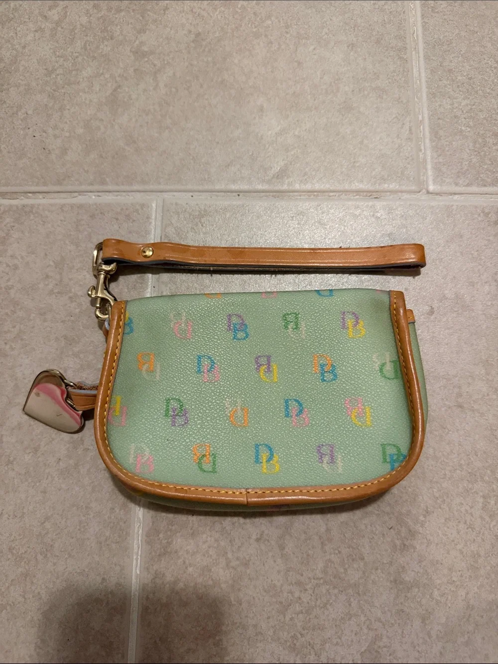 Dooney & Bourke Mint Wristlet with Multicolor Logo and Tan Trim